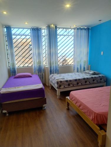 Giường trong phòng chung tại I rent a house in Mollendo