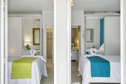 Postel nebo postele na pokoji v ubytování Villa Perle Dor