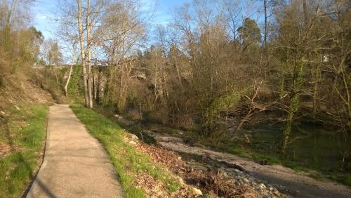 a dirt path next to a river with trees at Hotel Cemar in Mondariz