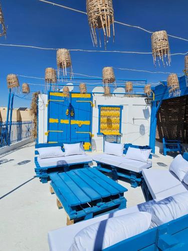 a group of blue and white beds on a boat at Dar Elyssa - Free Breakfast - Résidence Oasis Tozeur in Tozeur