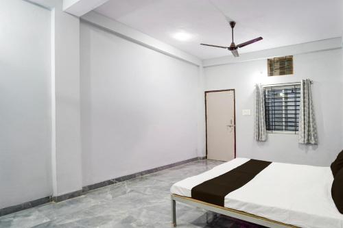 Ένα ή περισσότερα κρεβάτια σε δωμάτιο στο Hotel O Sangam Gardan