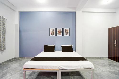 Ένα ή περισσότερα κρεβάτια σε δωμάτιο στο Hotel O Sangam Gardan