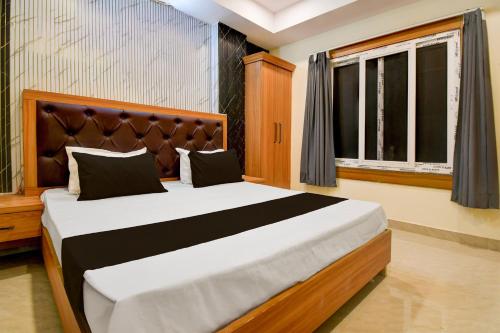 Ένα ή περισσότερα κρεβάτια σε δωμάτιο στο Hotel O AVR STAY INN