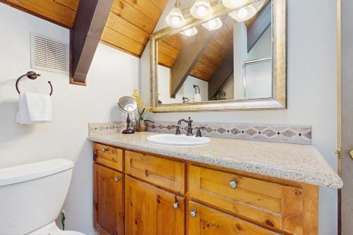 a bathroom with a sink and a mirror at Tallac Views Getaway in South Lake Tahoe
