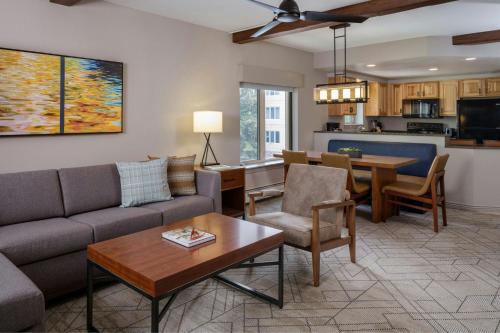 a living room with a couch and a table at Sheraton Lakeside Terrace Villas at Mountain Vista, Avon, Vail Valley in Avon