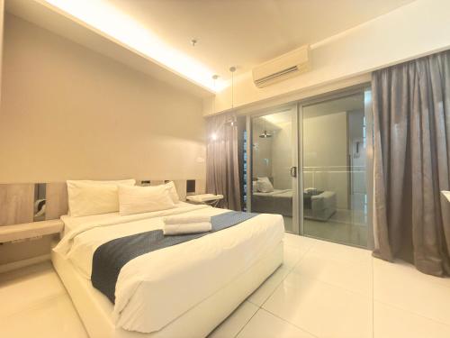 Ένα ή περισσότερα κρεβάτια σε δωμάτιο στο Summer popular suites kl Bukit Bintang