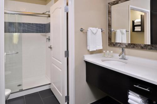 a bathroom with a sink and a shower at Staybridge Suites San Antonio-Stone Oak by IHG in San Antonio