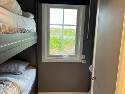 Ένα ή περισσότερα κρεβάτια σε δωμάτιο στο 5 star holiday home in Mastrand