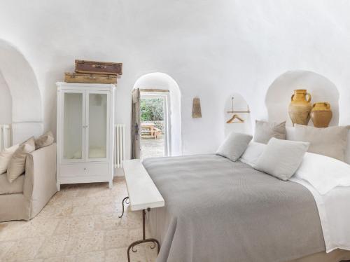 Postel nebo postele na pokoji v ubytování Trullo Amarcord