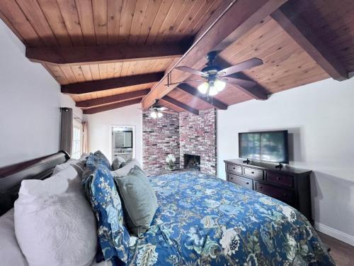 a bedroom with a bed and a ceiling fan at Destination #13 in Anaheim