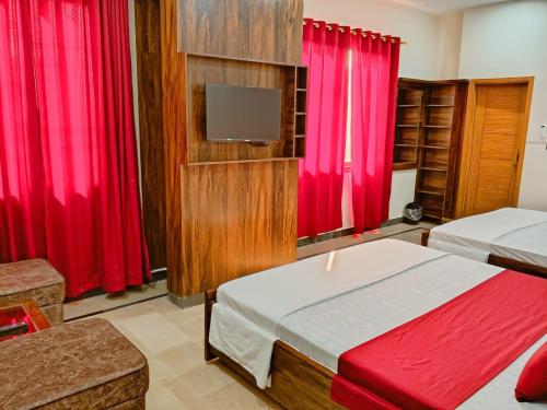 Ένα ή περισσότερα κρεβάτια σε δωμάτιο στο Airport Guest House - JIA