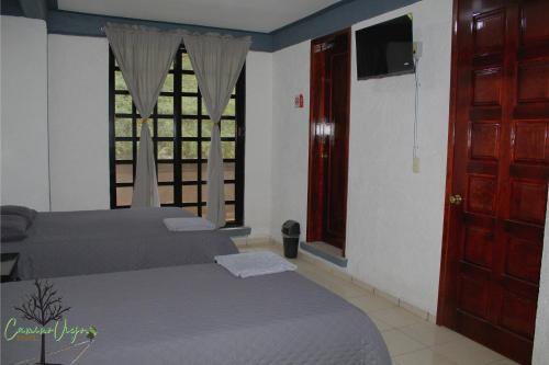 Ένα ή περισσότερα κρεβάτια σε δωμάτιο στο Hotel Boutique Camino Viejo