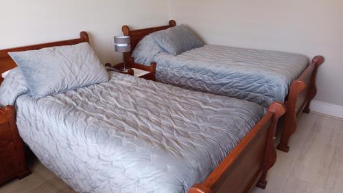 Ένα ή περισσότερα κρεβάτια σε δωμάτιο στο Hostal Terraza Traslaviña