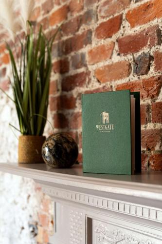 a book sitting on top of a white table at The Westgate in Winchester
