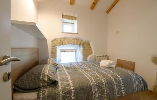 a bedroom with a bed and a window at House Casa Della Nonna in Kršan