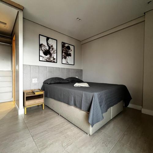 Ένα ή περισσότερα κρεβάτια σε δωμάτιο στο Refúgio Executivo Exclusivo Duplex com Ofurô