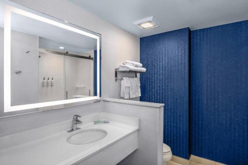 a bathroom with a sink and a mirror at Fairfield Inn & Suites by Marriott Edmonton North in Edmonton