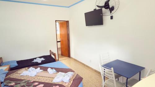 Postel nebo postele na pokoji v ubytování Nova Aliança Suítes por Temporada em Amparo NÃO SOMOS POUSADA