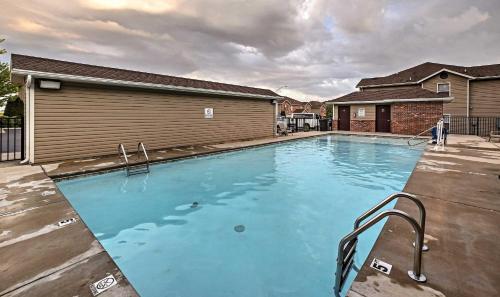a large blue swimming pool in a house at Rockwall Lodge - Close to Branson Strip in Branson