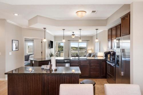 an open kitchen and living room in a home at Table Rock Overlook - Spend your Days on the Lake in Branson