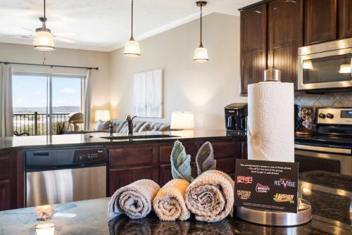 a kitchen with a counter with some towels on it at Table Rock Overlook - Spend your Days on the Lake in Branson