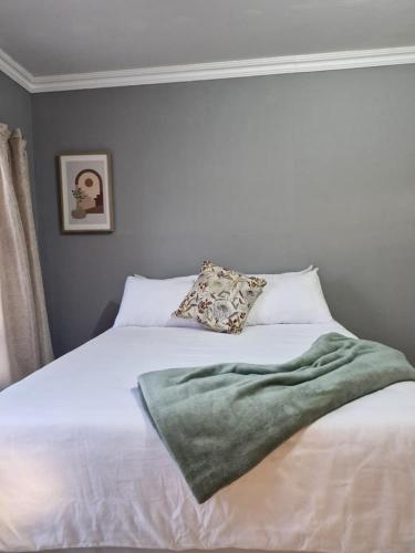 Ένα ή περισσότερα κρεβάτια σε δωμάτιο στο Ekukhanyeni Guest house