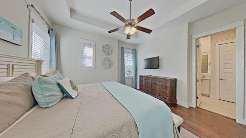 a bedroom with a bed and a ceiling fan at Prominence 30A - Mint Julep in Inlet Beach