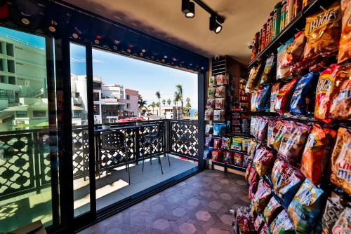 a store aisle with a view of a city at Cormorant Boutique Hotel in San Diego
