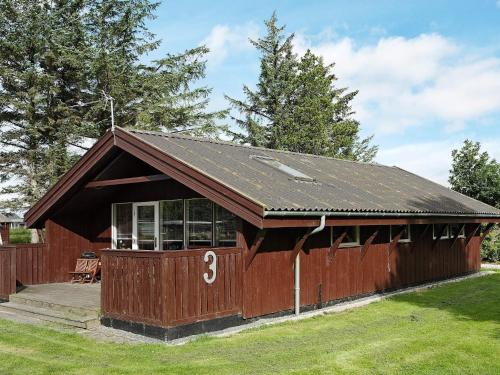 a small red building with the number three on it at 6 person holiday home in Storvorde-By Traum in Storvorde