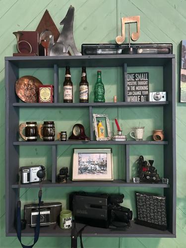 a shelf with lots of items on it at Hotel Brunette in Santa Ana