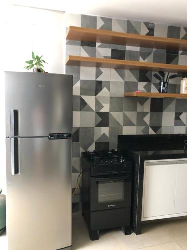 Kuchyň nebo kuchyňský kout v ubytování Quarto em Araras