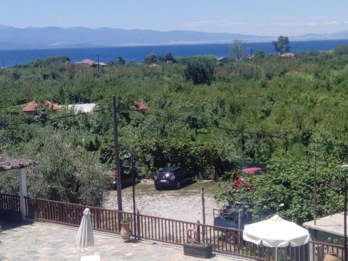a view from the balcony of a house with a car at Seralis Pelion in Afissos