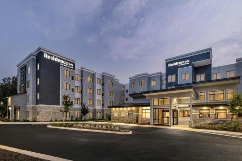 a rendering of a hotel with a parking lot at Residence Inn Richmond Airport in Sandston