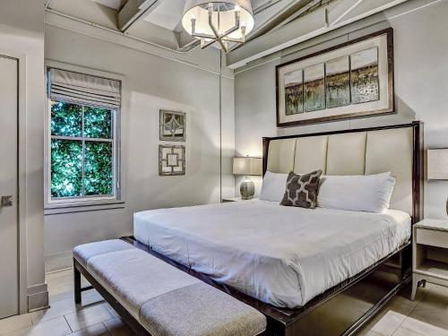 a bedroom with a large white bed and a window at Parker's Collection - 8 Bedroom in Savannah