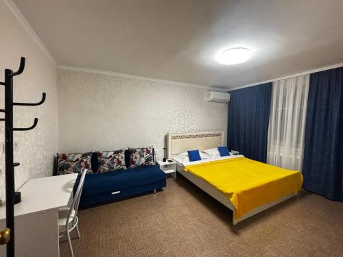 Ένα ή περισσότερα κρεβάτια σε δωμάτιο στο Апартаменты в центре города #1