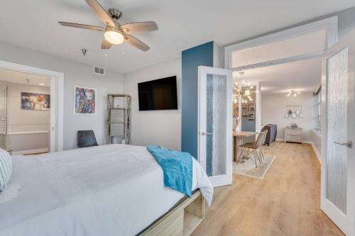 a bedroom with a large bed with a ceiling fan at Savannah Skyline in Savannah