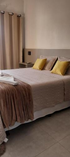 Ένα ή περισσότερα κρεβάτια σε δωμάτιο στο Flat's Da Bia