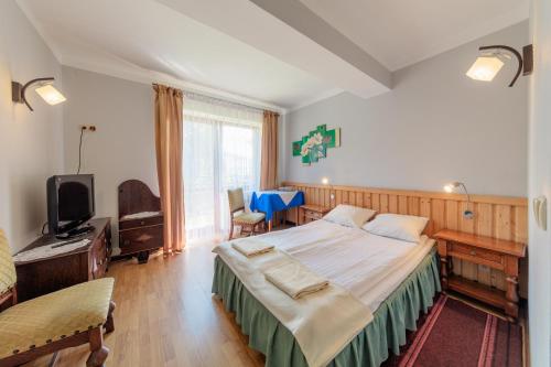 Postel nebo postele na pokoji v ubytování Dom Wypoczynkowy Podhalanka