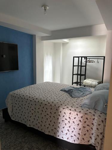 Ένα ή περισσότερα κρεβάτια σε δωμάτιο στο Momentos de Paz