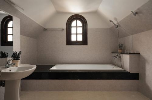 En eller flere senge i et værelse på Villa Paradise 6 Bedrooms