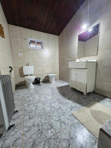 a bathroom with a sink and a toilet at Quinta Los Sauces in San Miguel del Monte