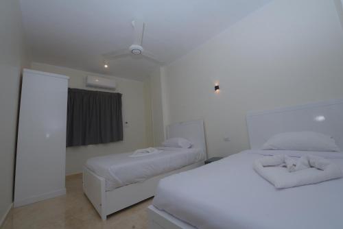 Postel nebo postele na pokoji v ubytování King Nile Luxor