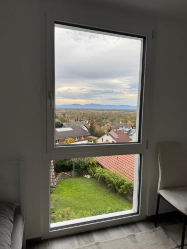 a window in a room with a view at Haus am Vogesenblick - Ihr Zimmer mit Aussicht für bis zu 3 Personen in Bad Bellingen