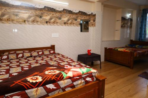 Ένα ή περισσότερα κρεβάτια σε δωμάτιο στο valparai villas