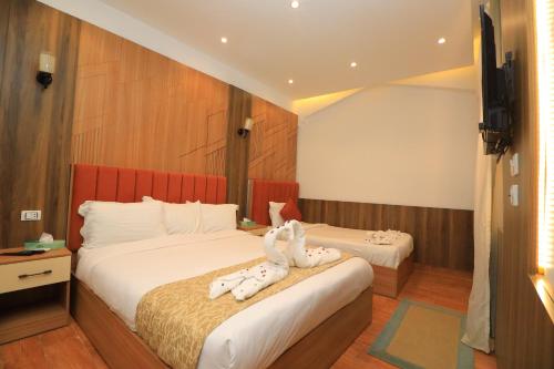 Ένα ή περισσότερα κρεβάτια σε δωμάτιο στο Sóul In Pyramids View