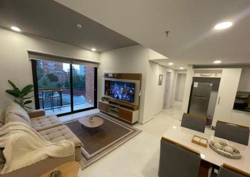 TV a/nebo společenská místnost v ubytování Modern apartment in Las Mercedes - Asunción