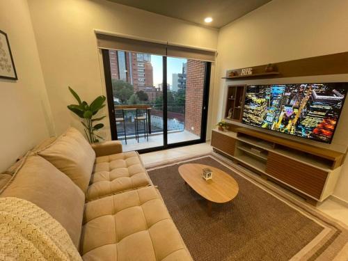 TV a/nebo společenská místnost v ubytování Modern apartment in Las Mercedes - Asunción