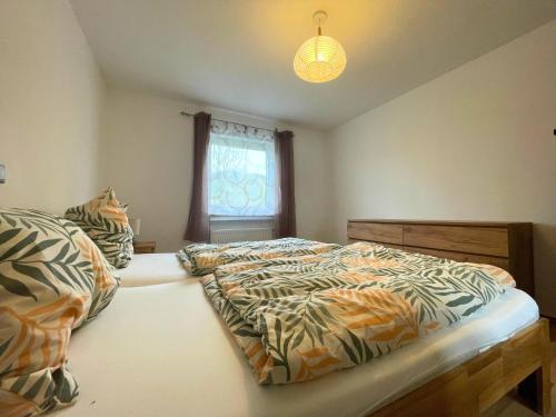 Ένα ή περισσότερα κρεβάτια σε δωμάτιο στο Holiday Home in Birresborn with balcony