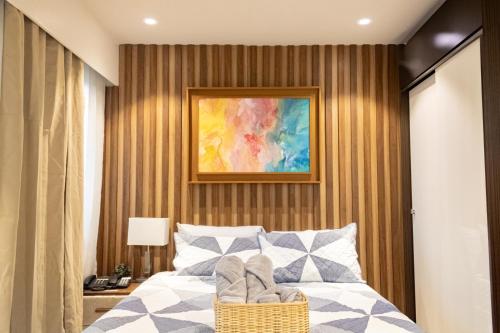 Postel nebo postele na pokoji v ubytování Kate & Keith's Place - Tambuli Seaside Living