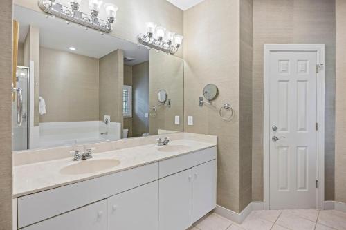 a bathroom with a sink and a large mirror at SM05: 5 Silver Moss in Kiawah Island